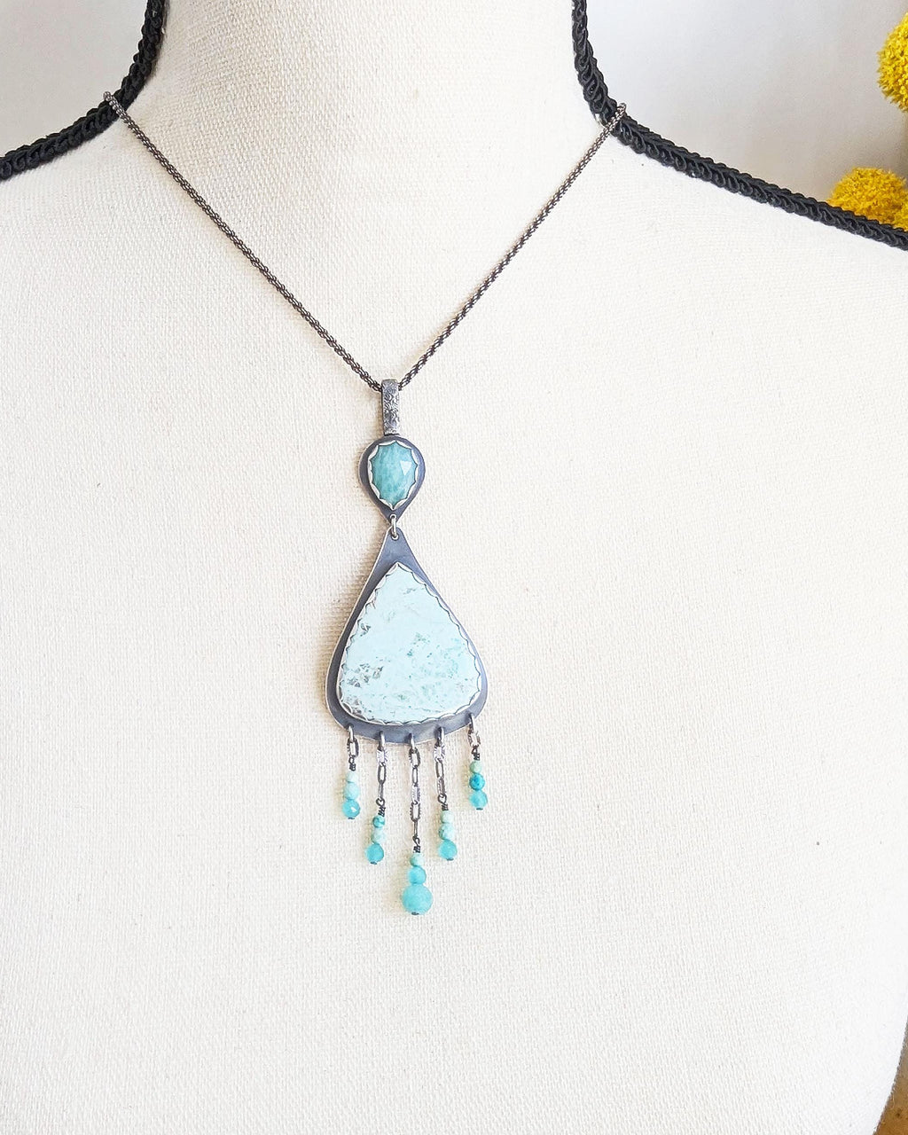 Peruvian blue-green stone with amazonite and fringe shown on bust and chain (not included) for scale