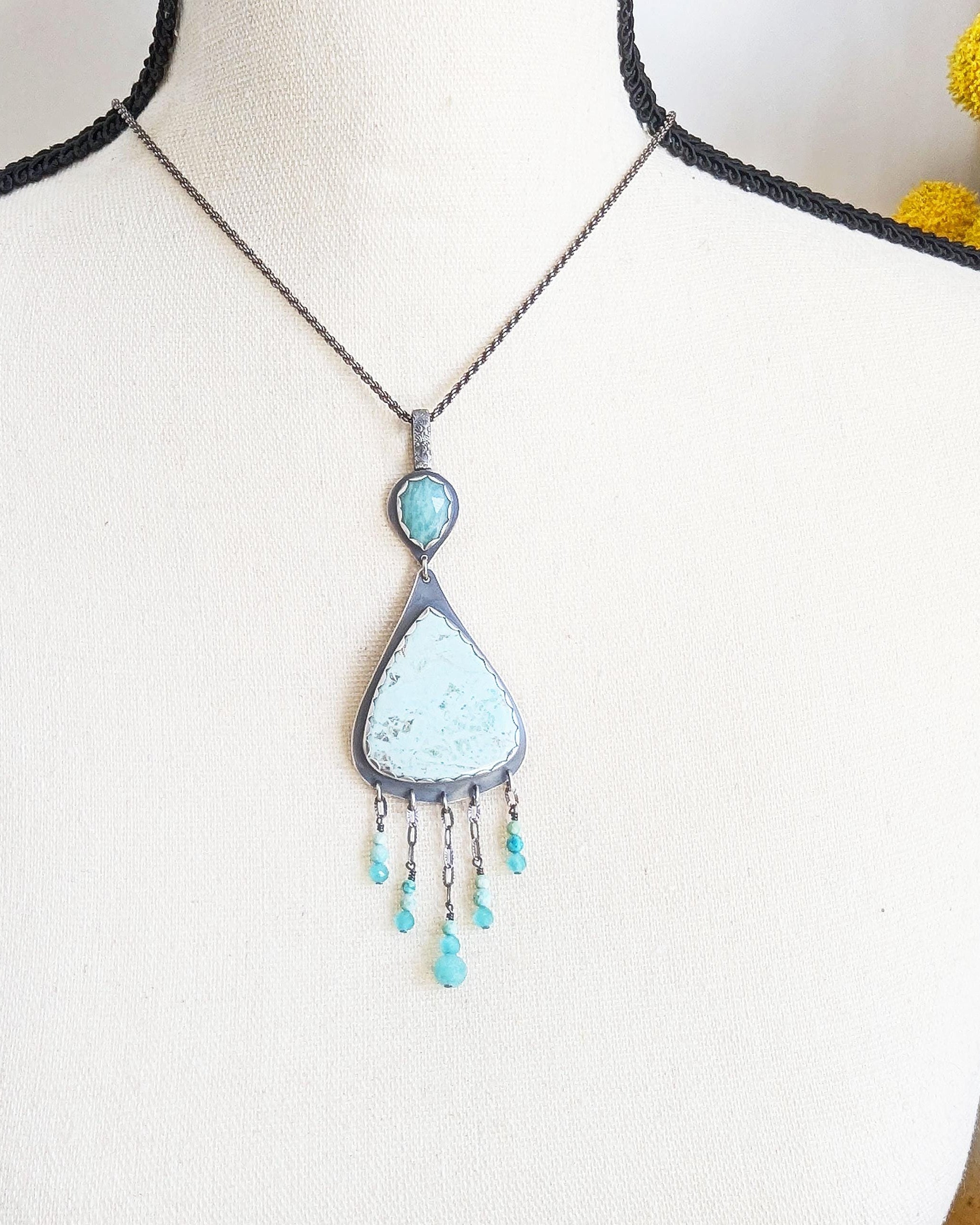 Peruvian blue-green stone with amazonite and fringe shown on bust and chain (not included) for scale