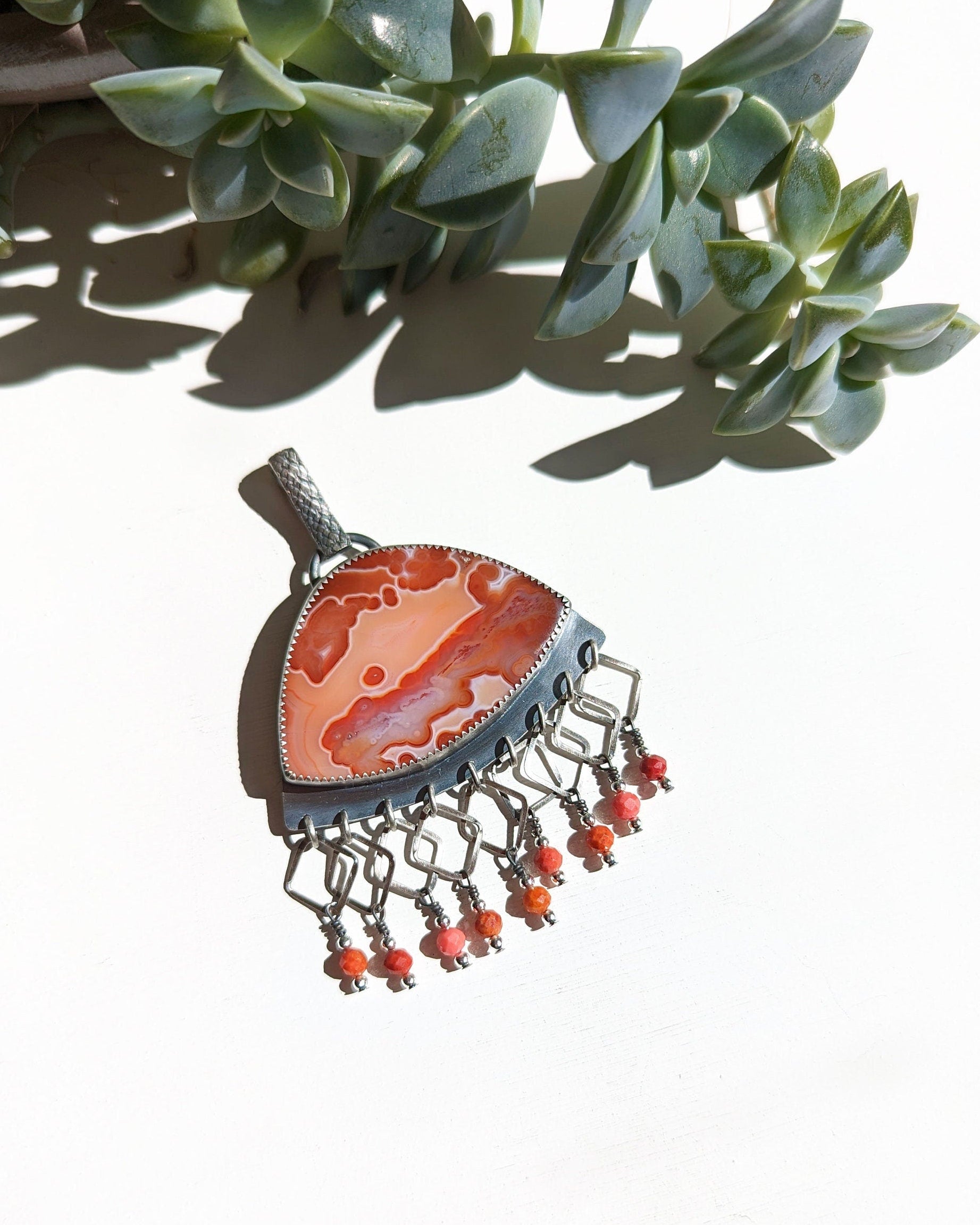 Orange agate fringe pendant with coral beads in oxidized sterling silver