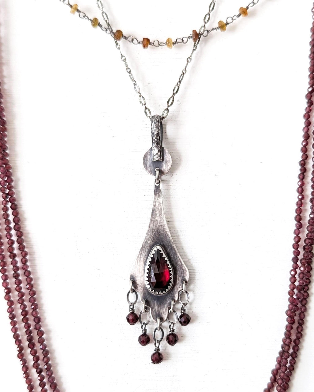 Rose cut red garnet pendant in oxidized sterling silver on chain with layering necklaces (not included)