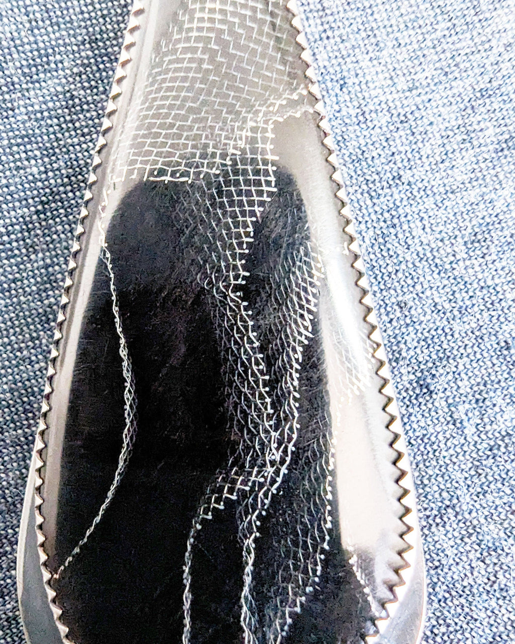 Moody boho pendant featuring Raffir black web resin and hematite bail stone close up