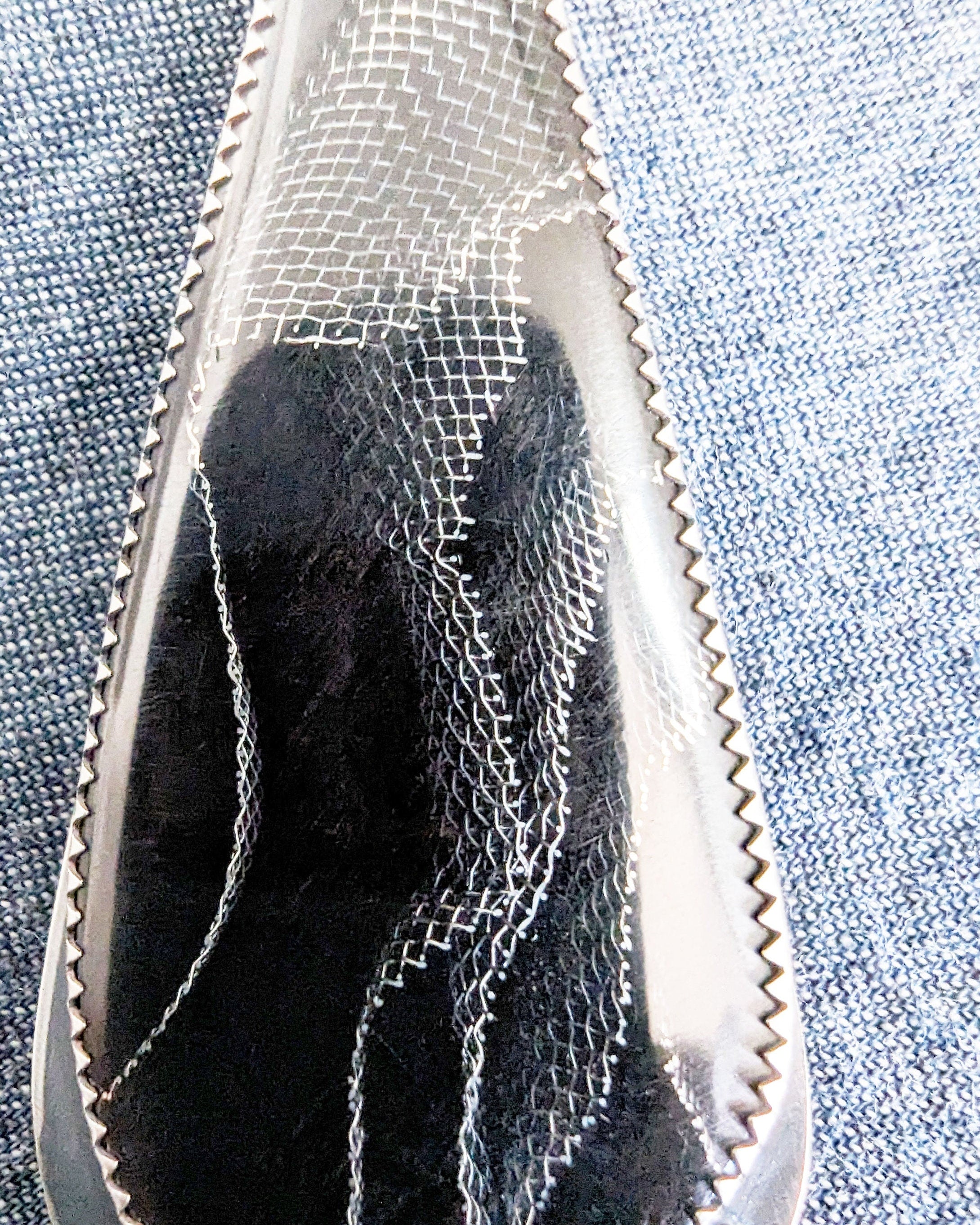 Moody boho pendant featuring Raffir black web resin and hematite bail stone close up