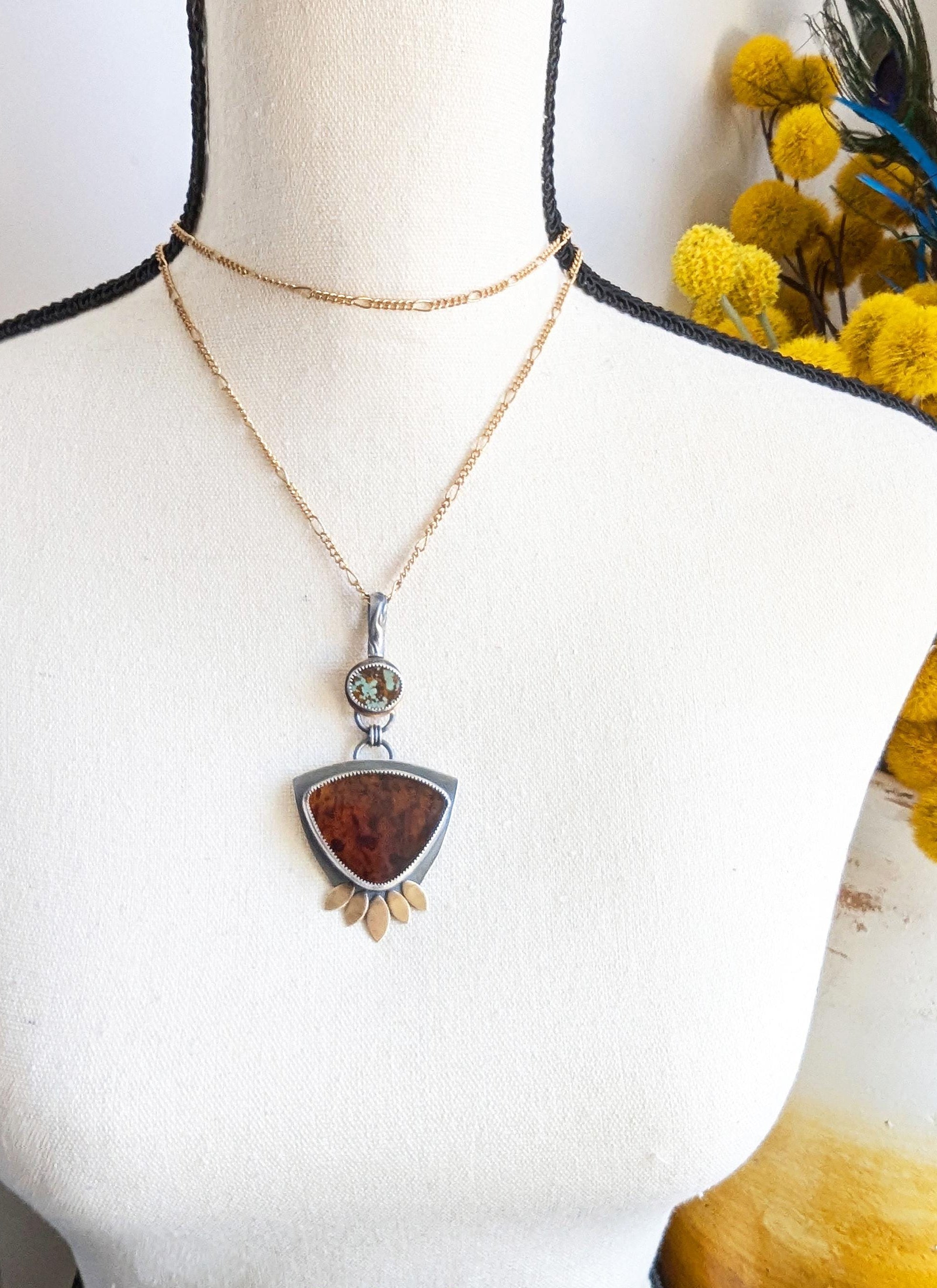 Boho luxe pendant featuring stabilized turquoise and glowing amber shown on bust for size (chain not included)