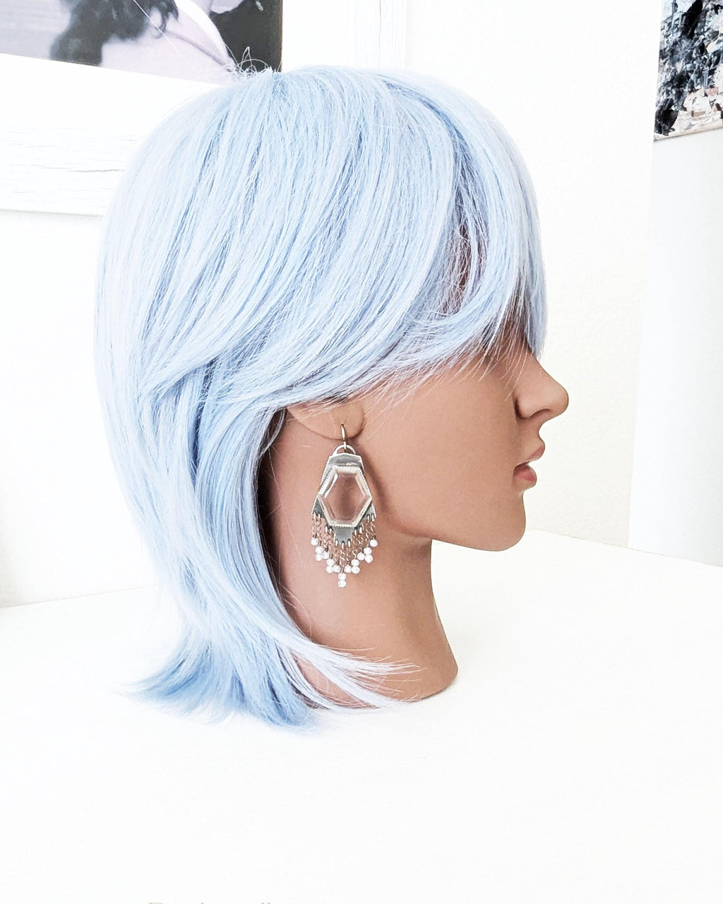 Large hydro quartz crystal earrings worn for scale on mannequin
