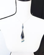 Gothic statement pendant with webbed resin cabochon and blue topaz beads on bust for size (chain not included)