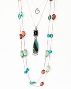 Earthy turquoise and black gemstone pendant