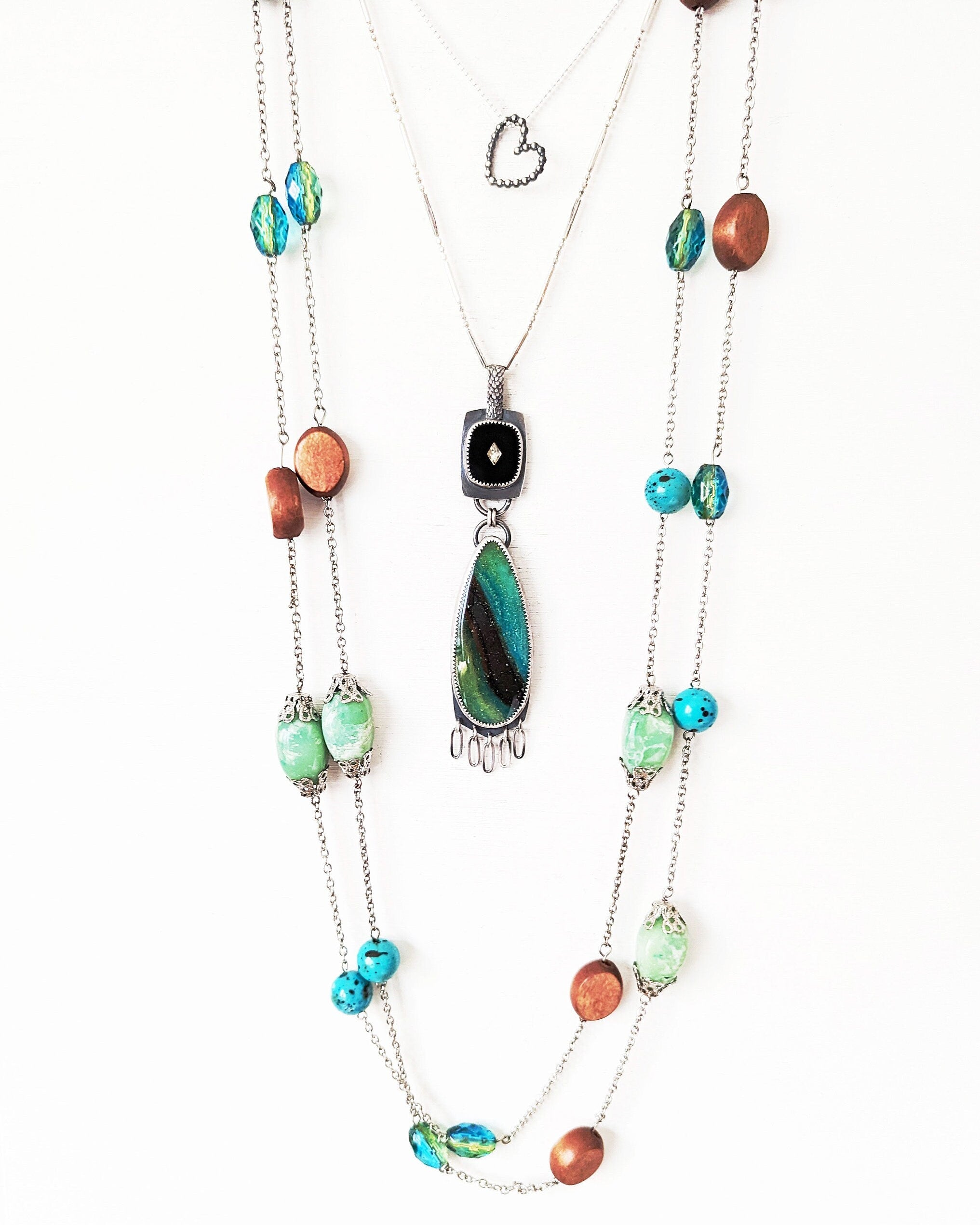Earthy turquoise and black gemstone pendant