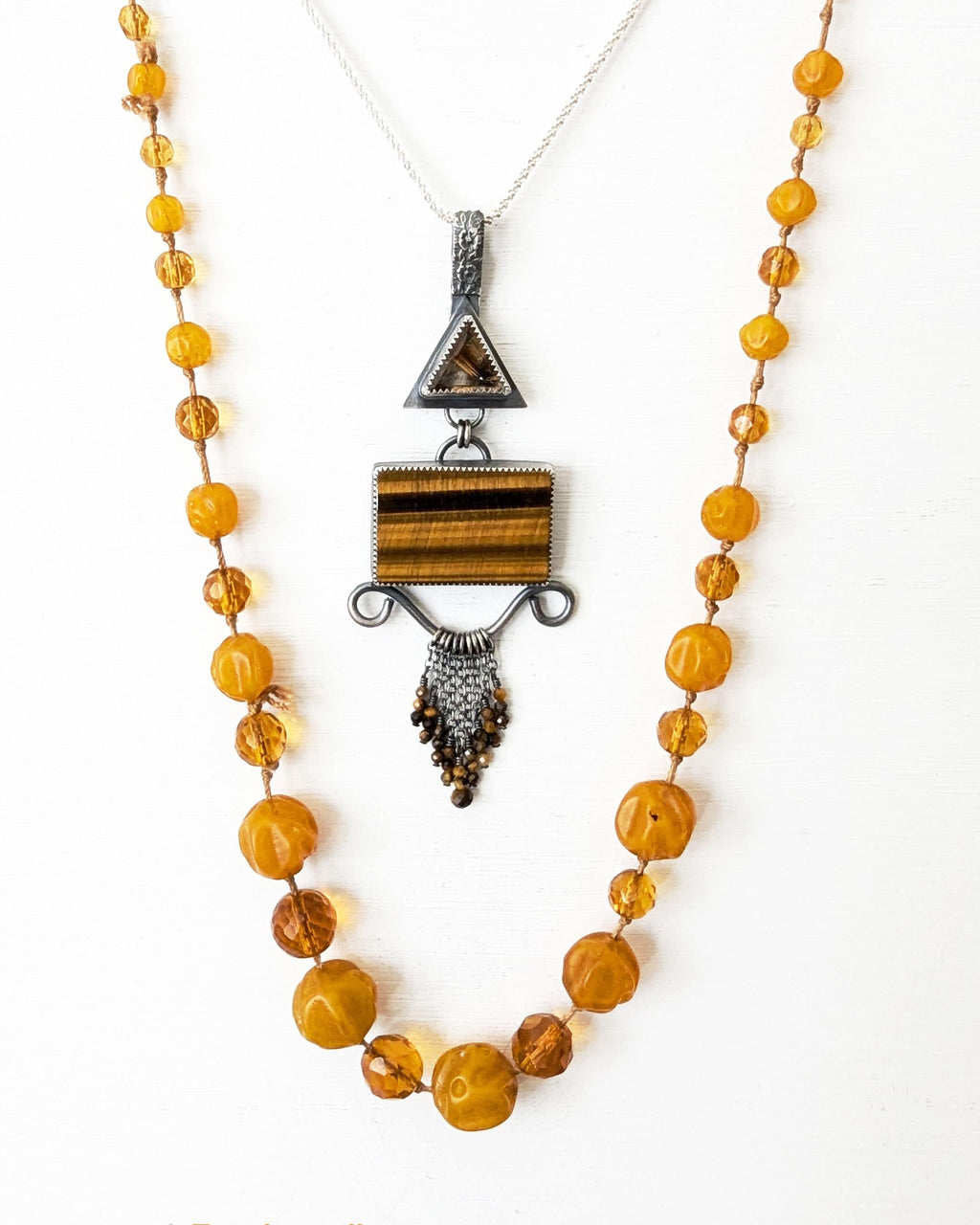 Chunky filigree gemstone pendant with tiger’s eye bead fringe