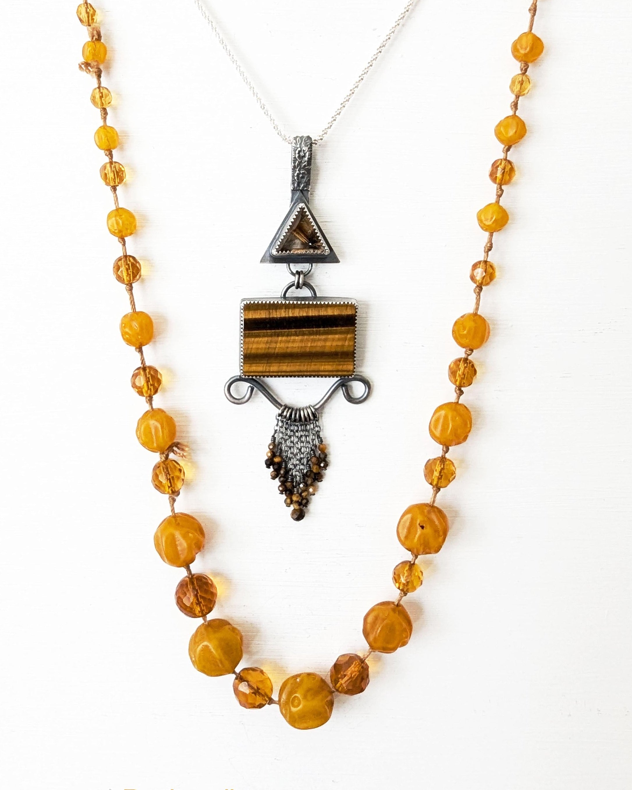 Chunky filigree gemstone pendant with tiger’s eye bead fringe