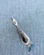 Raffir web resin pendant with deep blue grey cabochon and sterling silver fringe