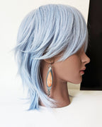 Lightweight sterling silver earrings perfect for beach style on mannequin for scale