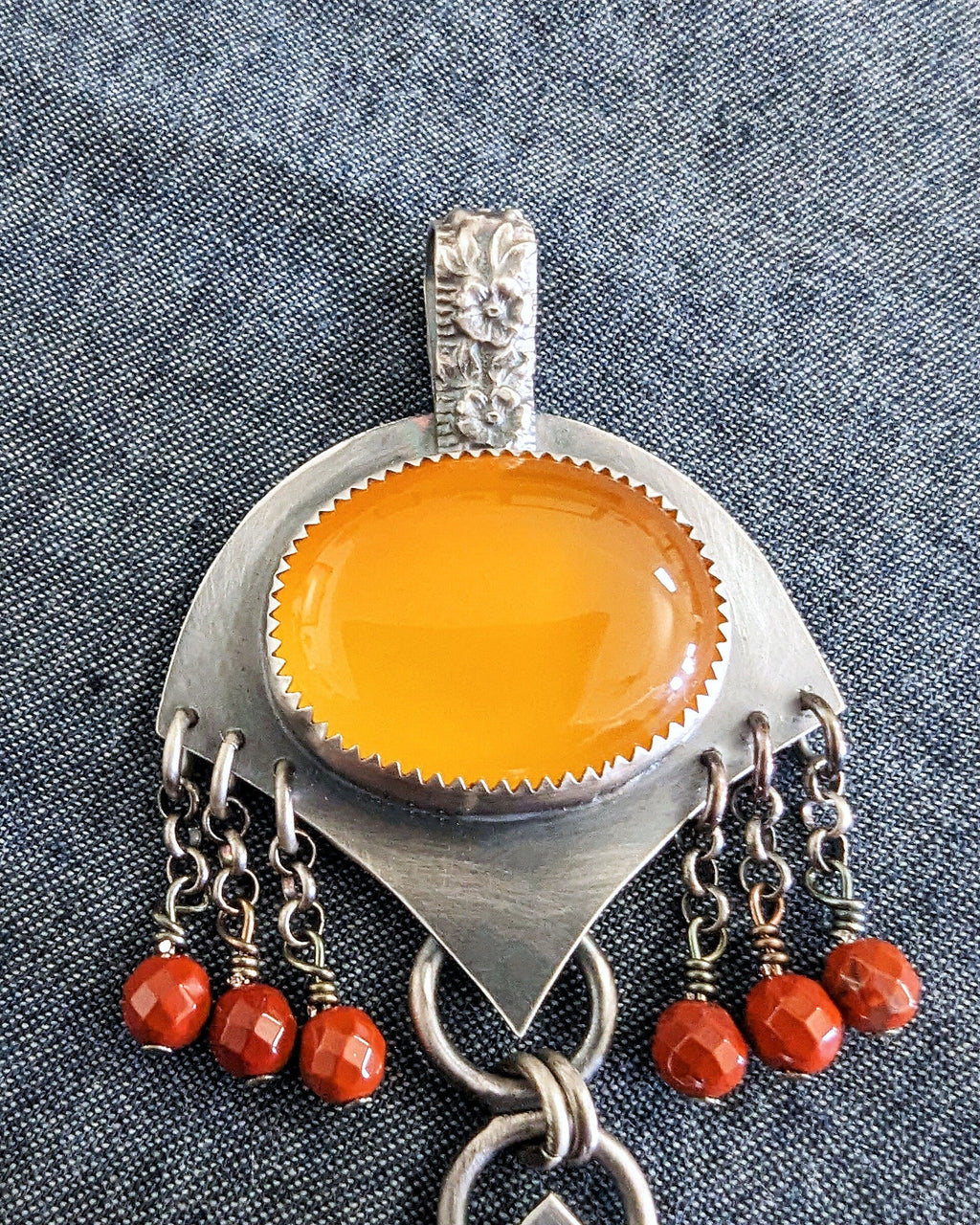 Close up of honey chalcedony and red jasper beads