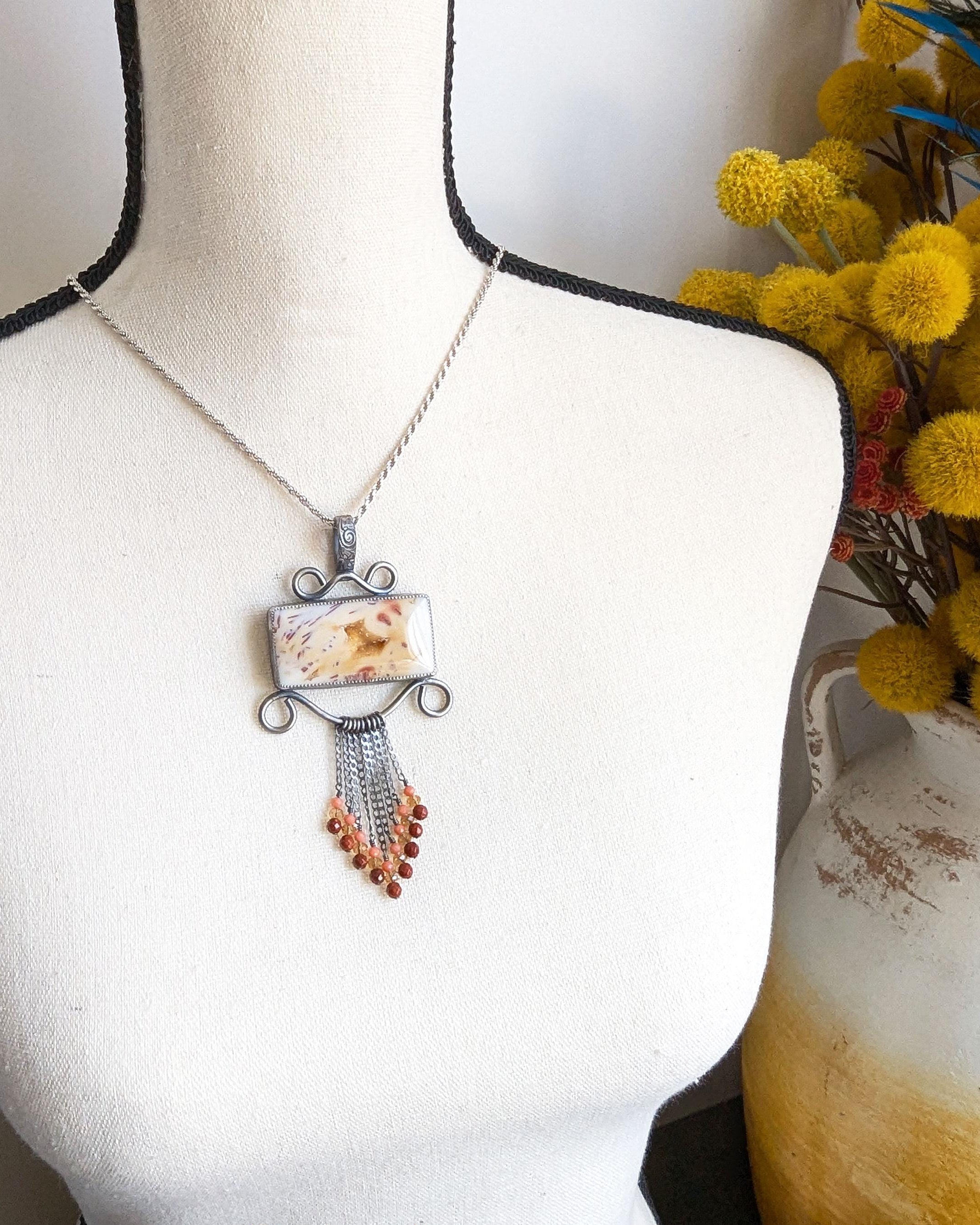 One of a kind sugar palm agate druzy pendant with filigree design shown on bust for scale