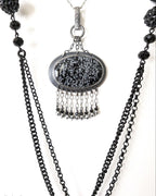Snowflake obsidian pendant on chain to show width and length
