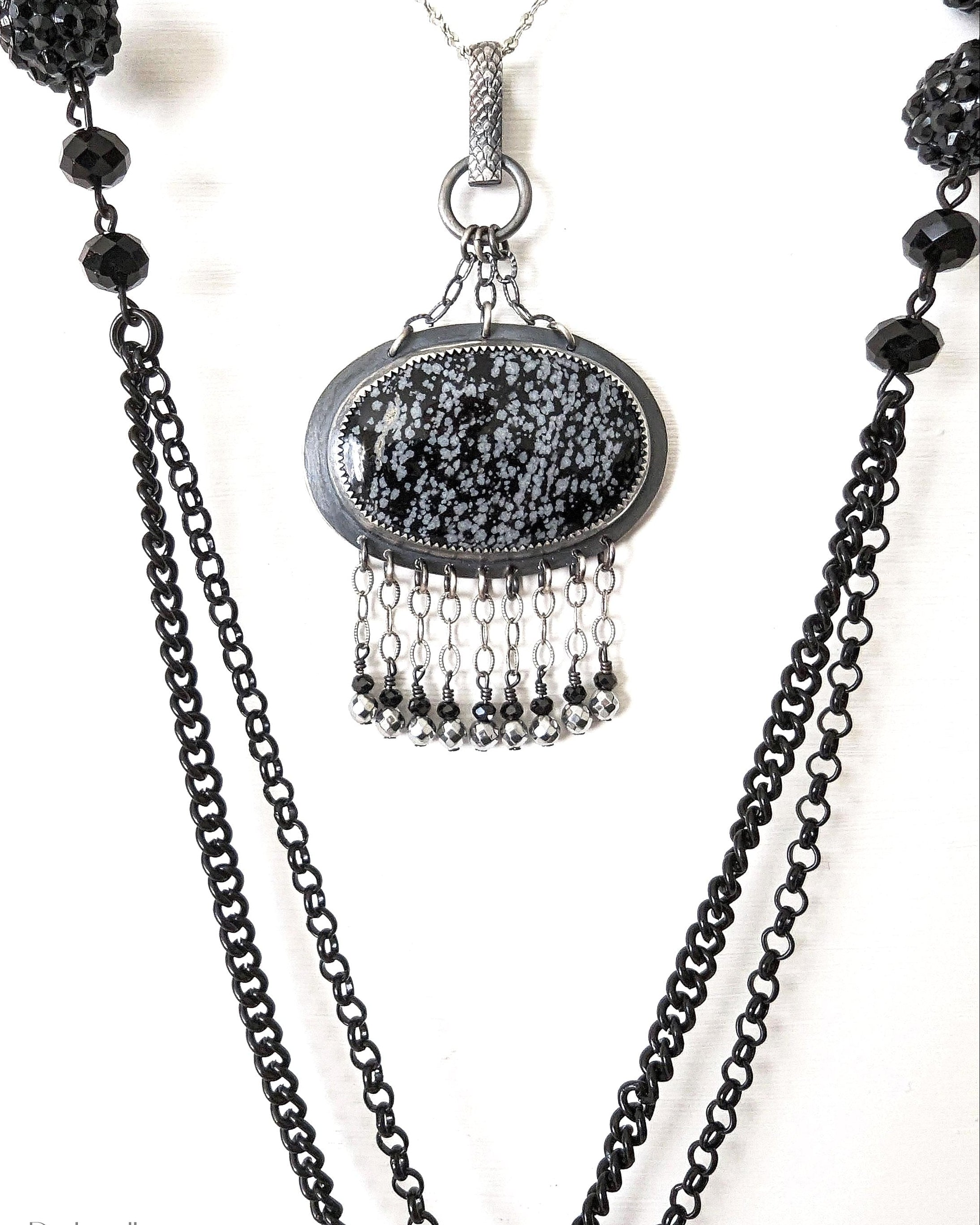 Snowflake obsidian pendant on chain to show width and length
