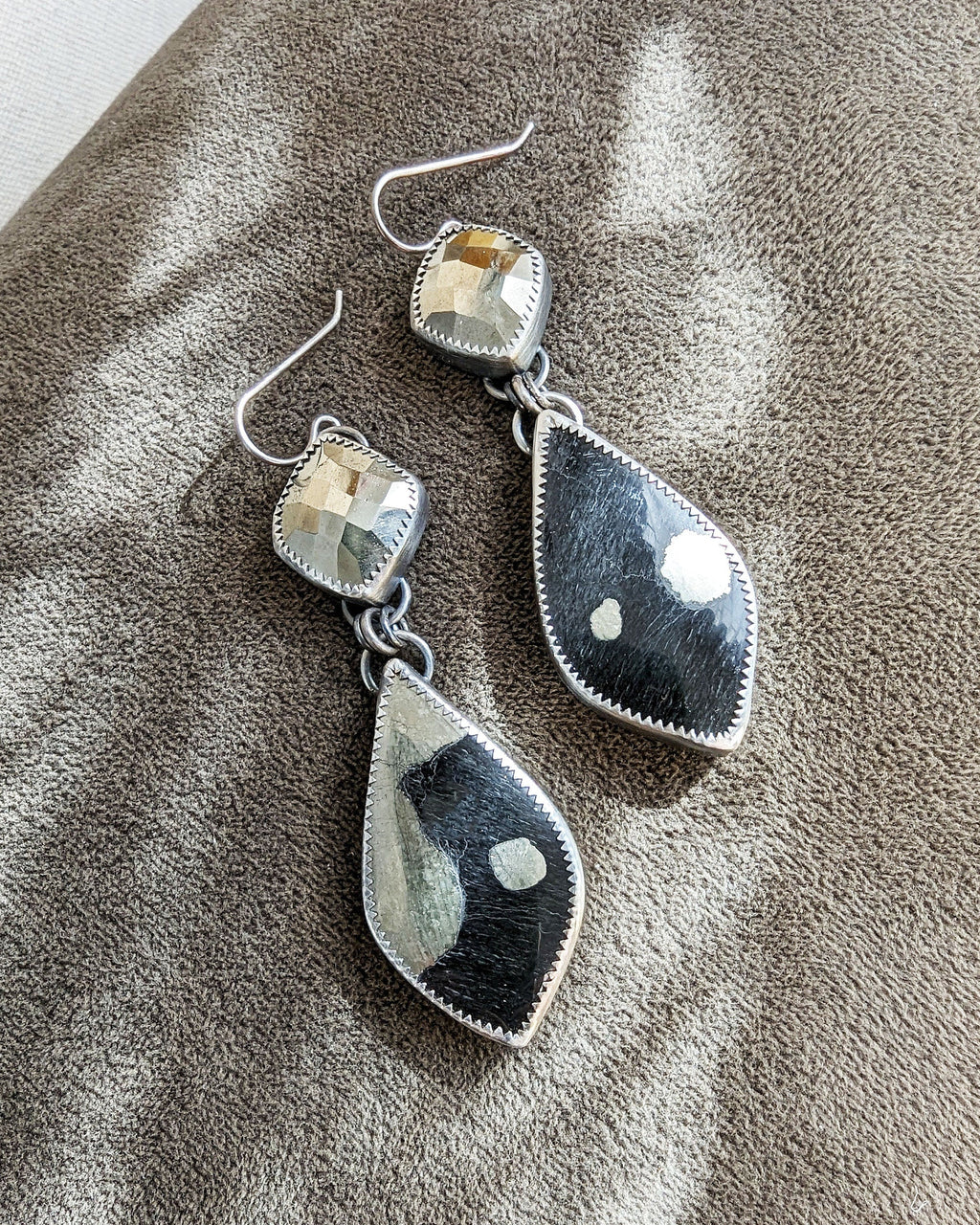 Oxidized sterling silver earrings featuring metallic gold pyrite stones