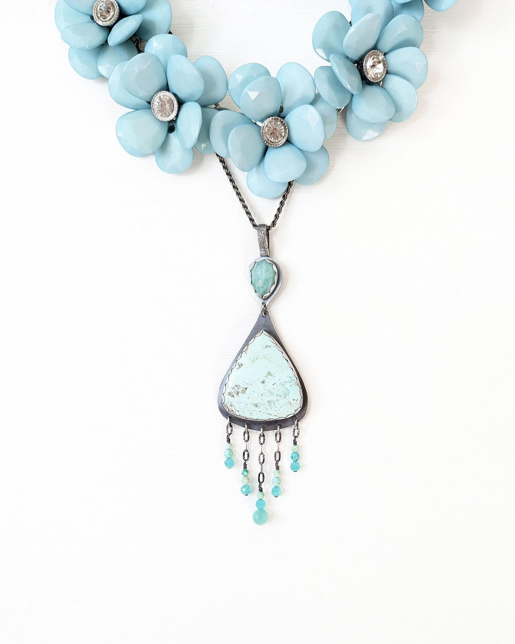 Handcrafted chrysocolla and amazonite pendant by Rebellenhaus shown with layer necklace for style (not included)