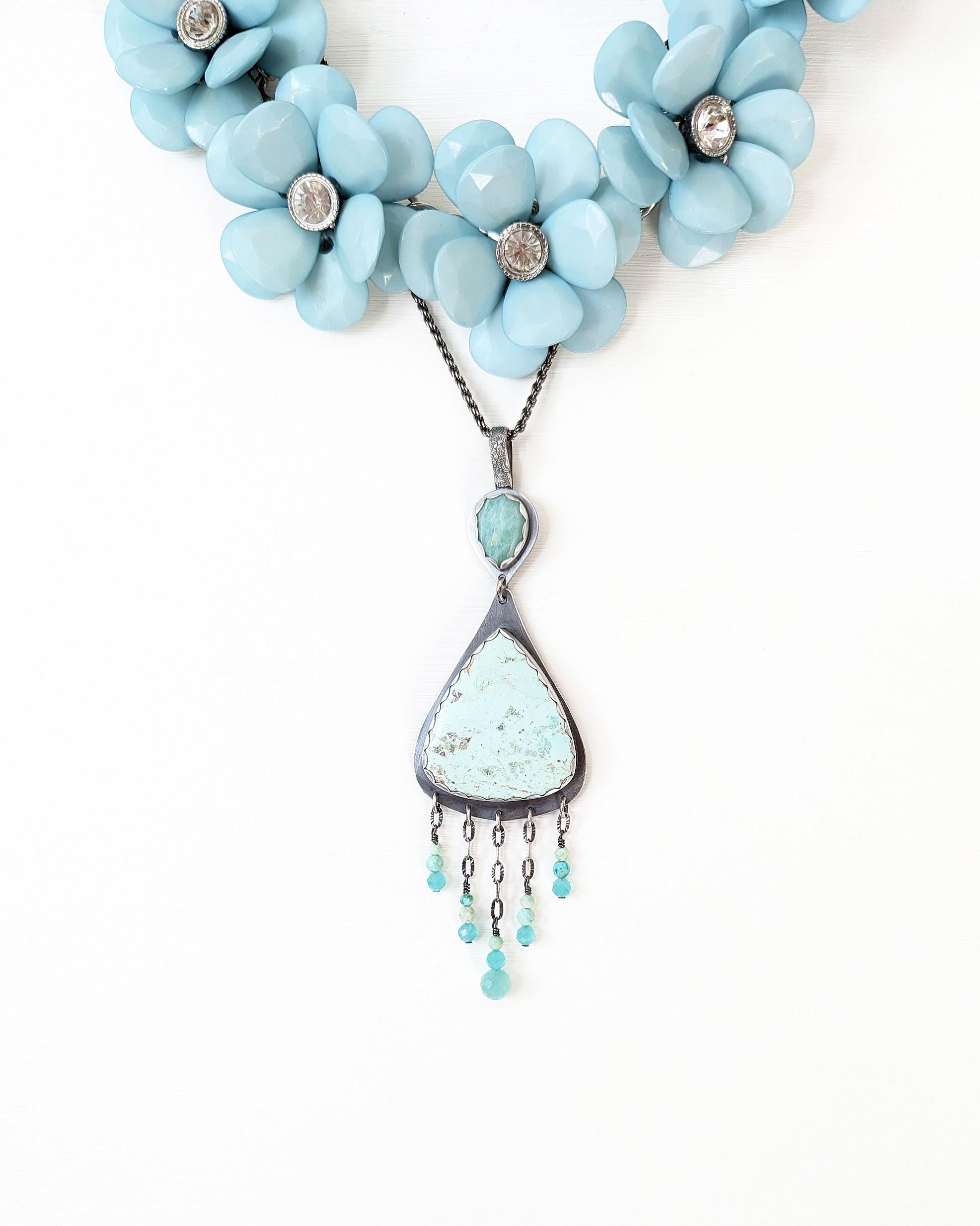 Handcrafted chrysocolla and amazonite pendant by Rebellenhaus shown with layer necklace for style (not included)