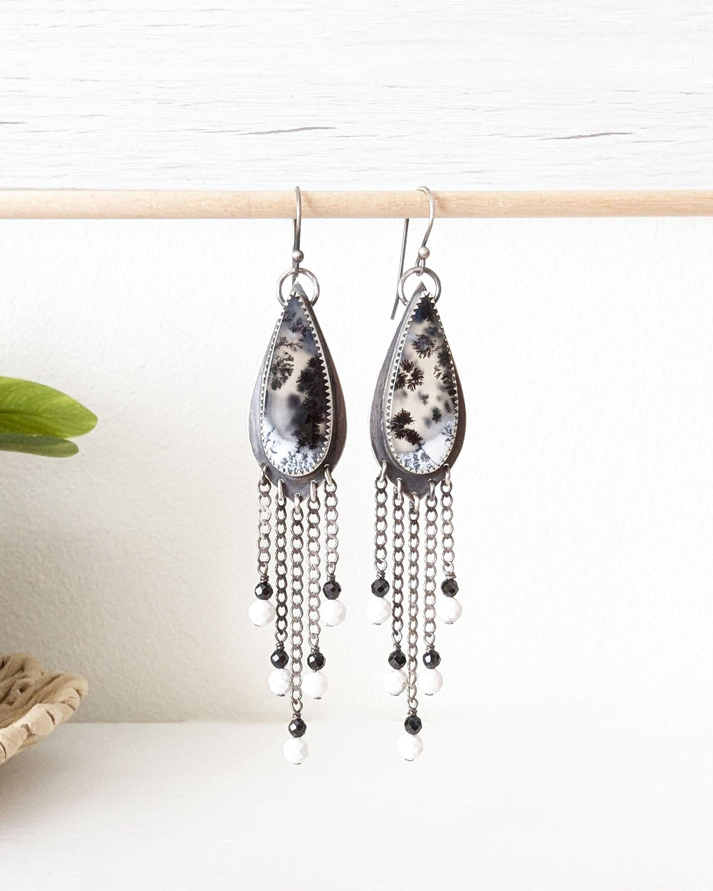 Dendritic opal leaf earrings with black spinel and white howlite fringe
