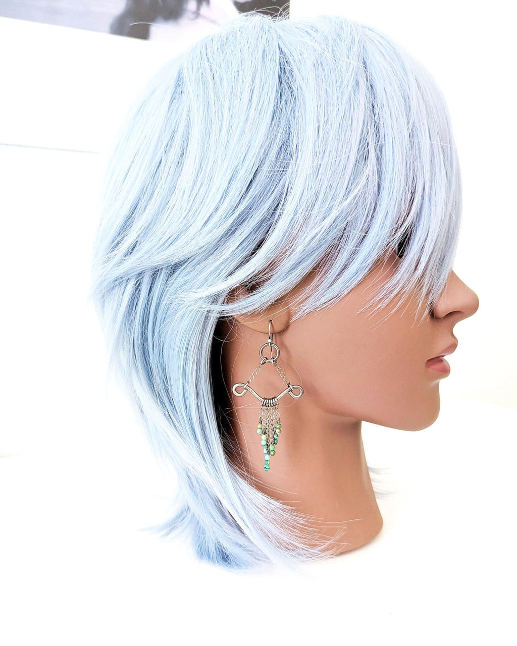Boho western turquoise statement earrings with hammered texture on mannequin for scale