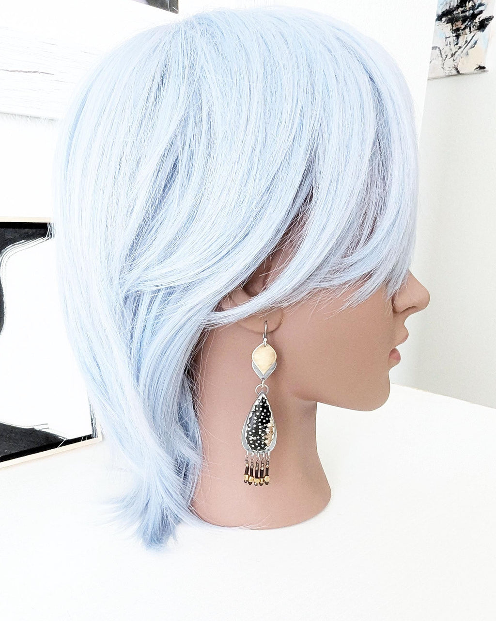 Regal boho luxe earrings featuring palm root and metallic accents