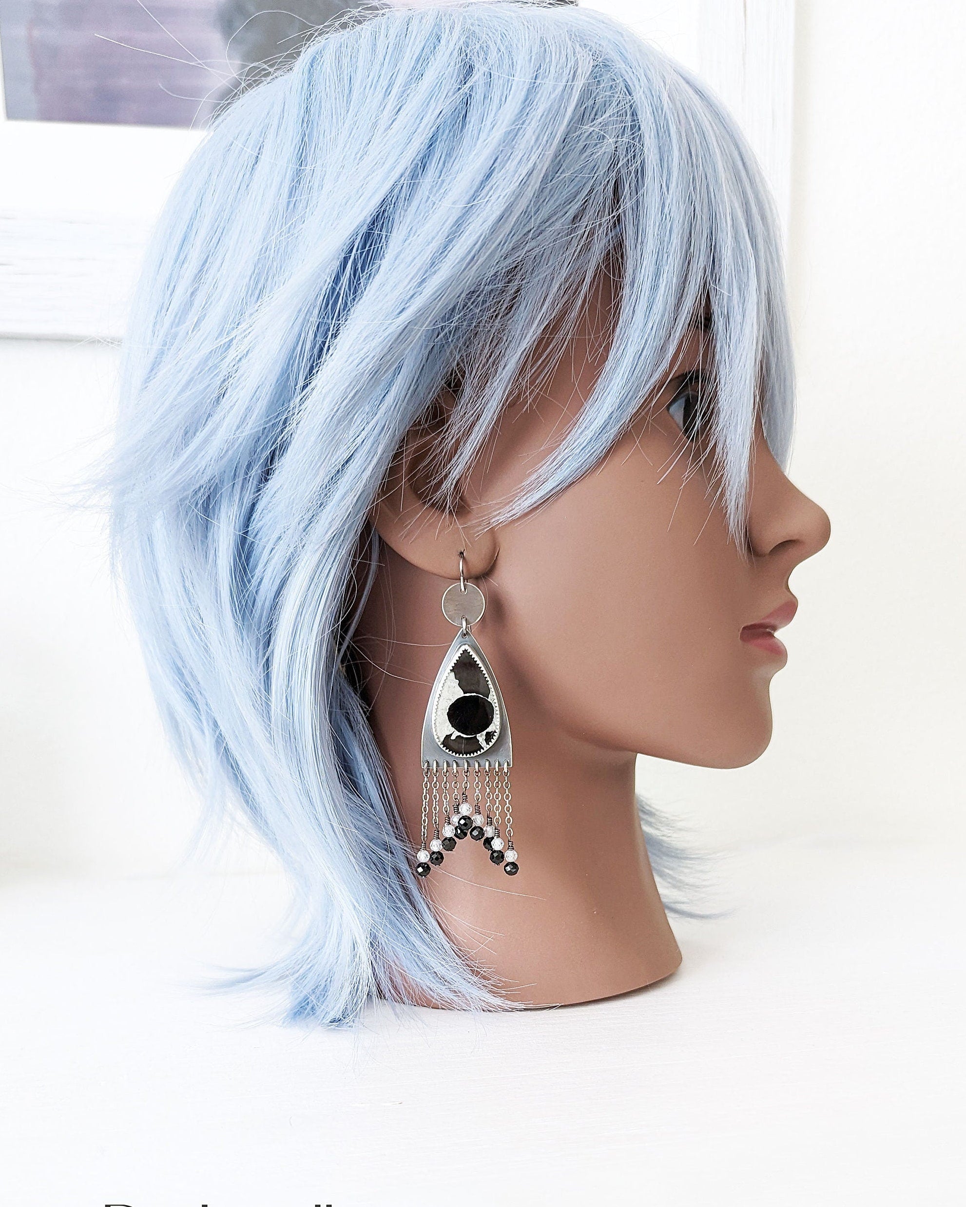 Heavyweight septarian fossil earrings worn for size reference
