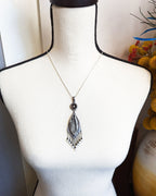 Two-stone sterling silver necklace with vintage glass accent shown on bust for scale