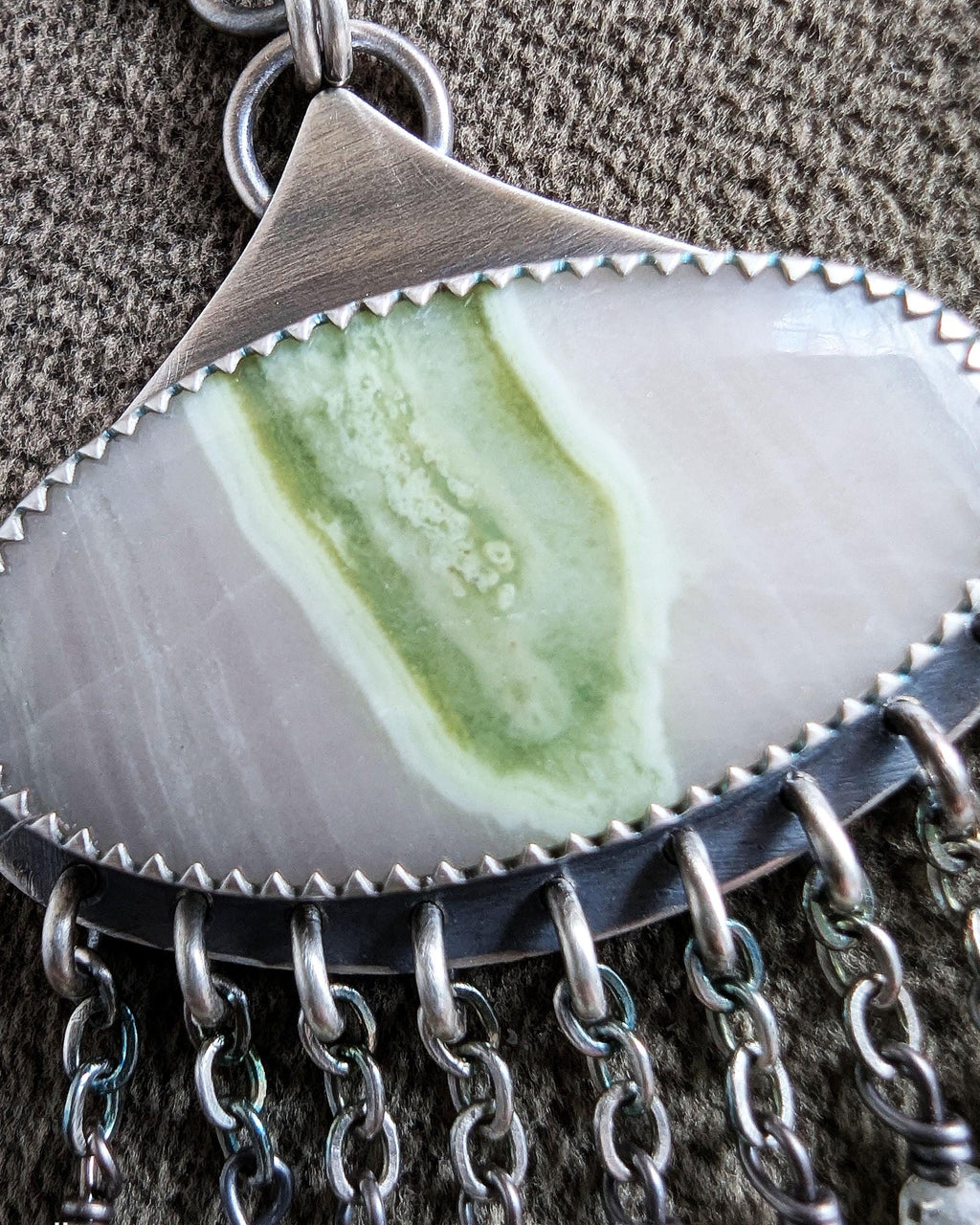 Close up of fresh spring-inspired artisan statement earrings