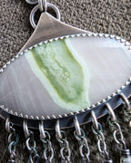 Close up of fresh spring-inspired artisan statement earrings