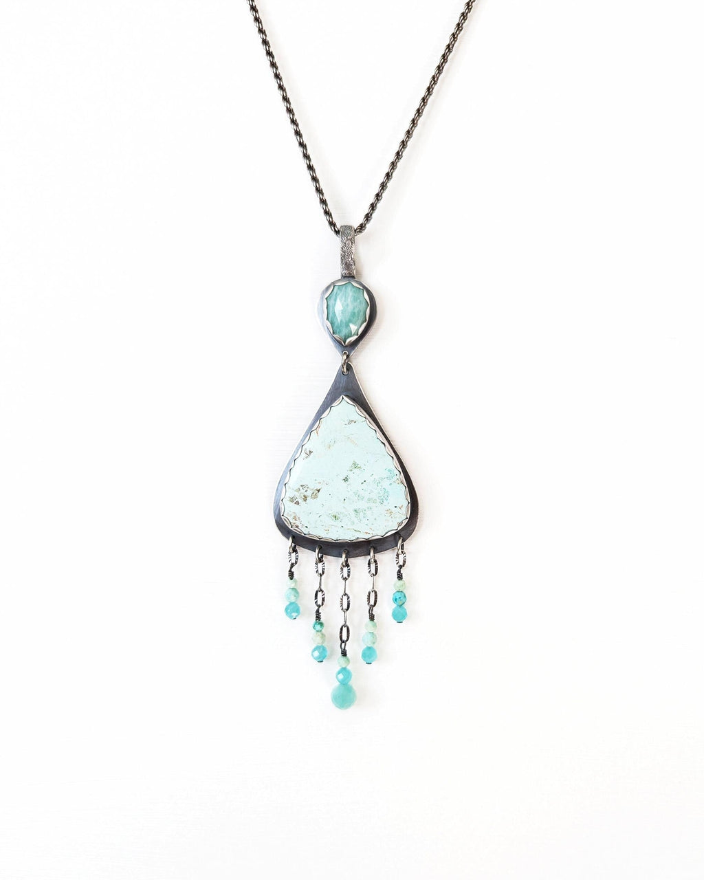 Pear shaped artisan silver pendant in pale aqua tones on chain (not included)
