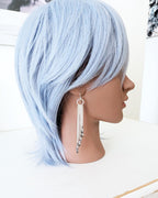 Sparkling grey crystal and metallic fringe statement earrings