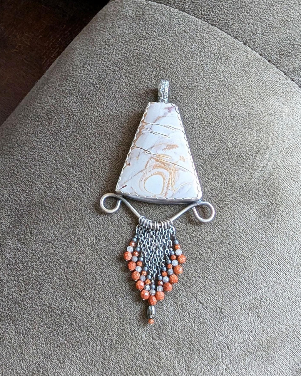 Rhyolite jasper pendant with mustard and mauve Picasso-like pattern