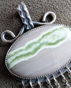 Close up of serpentine stone in artisan pendant