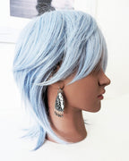 One of a kind black and white palm root agate earrings by Rebellenhaus on mannequin for scale