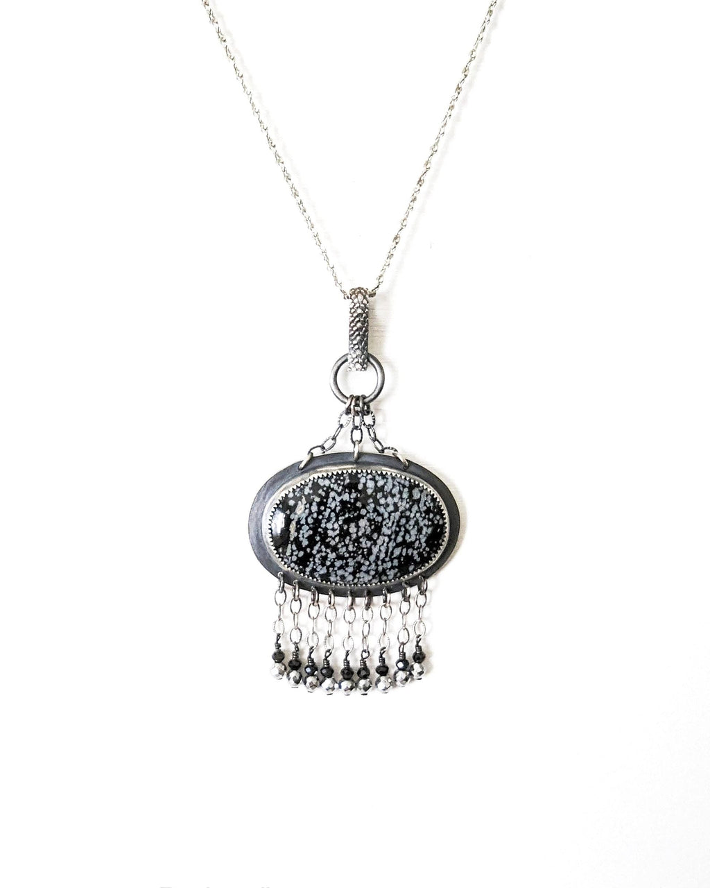 Chain fringe with black spinel and silver-coated pyrite on obsidian pendant
