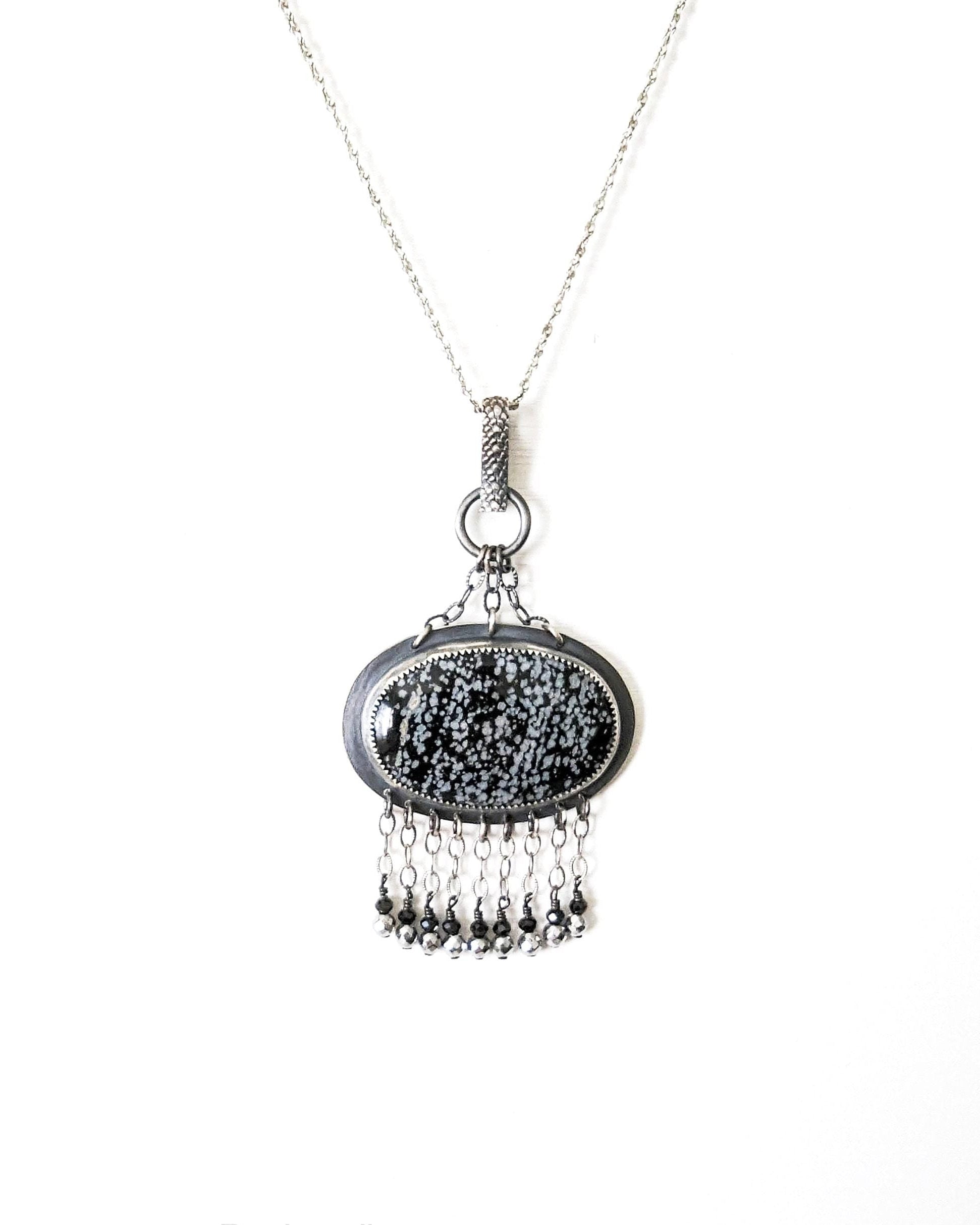 Chain fringe with black spinel and silver-coated pyrite on obsidian pendant
