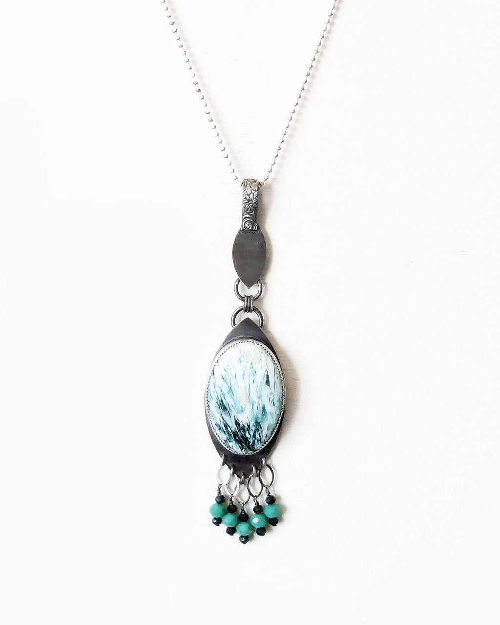 Large oval scolecite gemstone pendant with oxidized sterling silver bail shown on chain (not included)