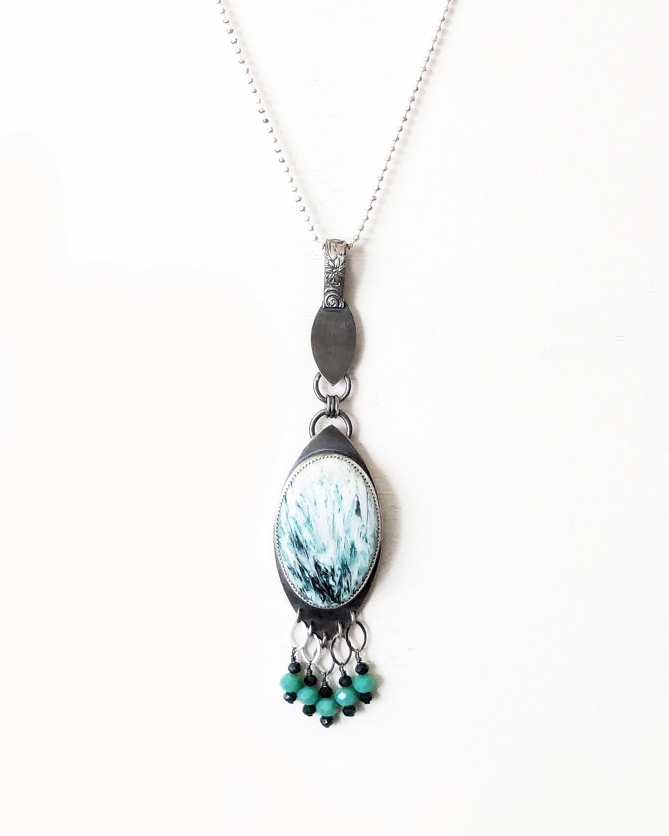 Large oval scolecite gemstone pendant with oxidized sterling silver bail shown on chain (not included)