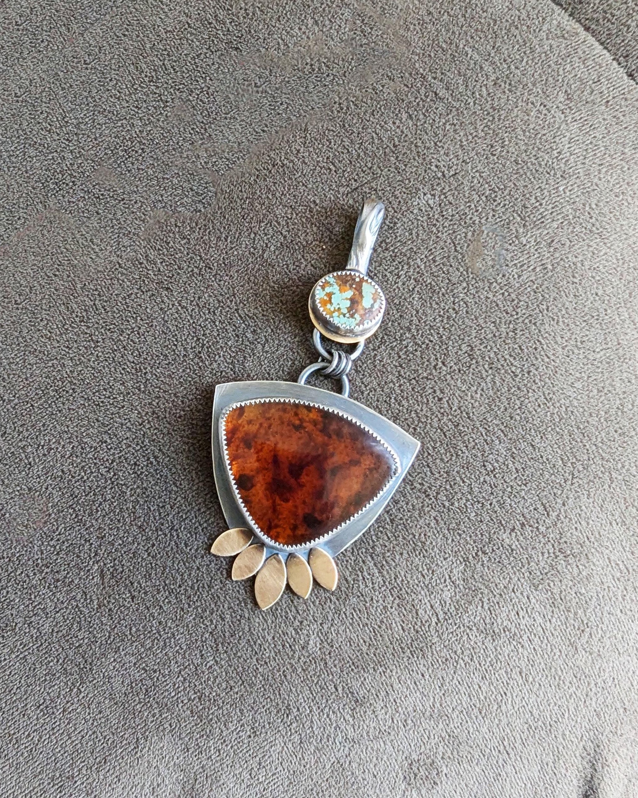 Artisan handmade turquoise and amber pendant with brass petal accents
