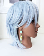 Nature inspired statement earrings with coastal blue and green tones on mannequin for scale
