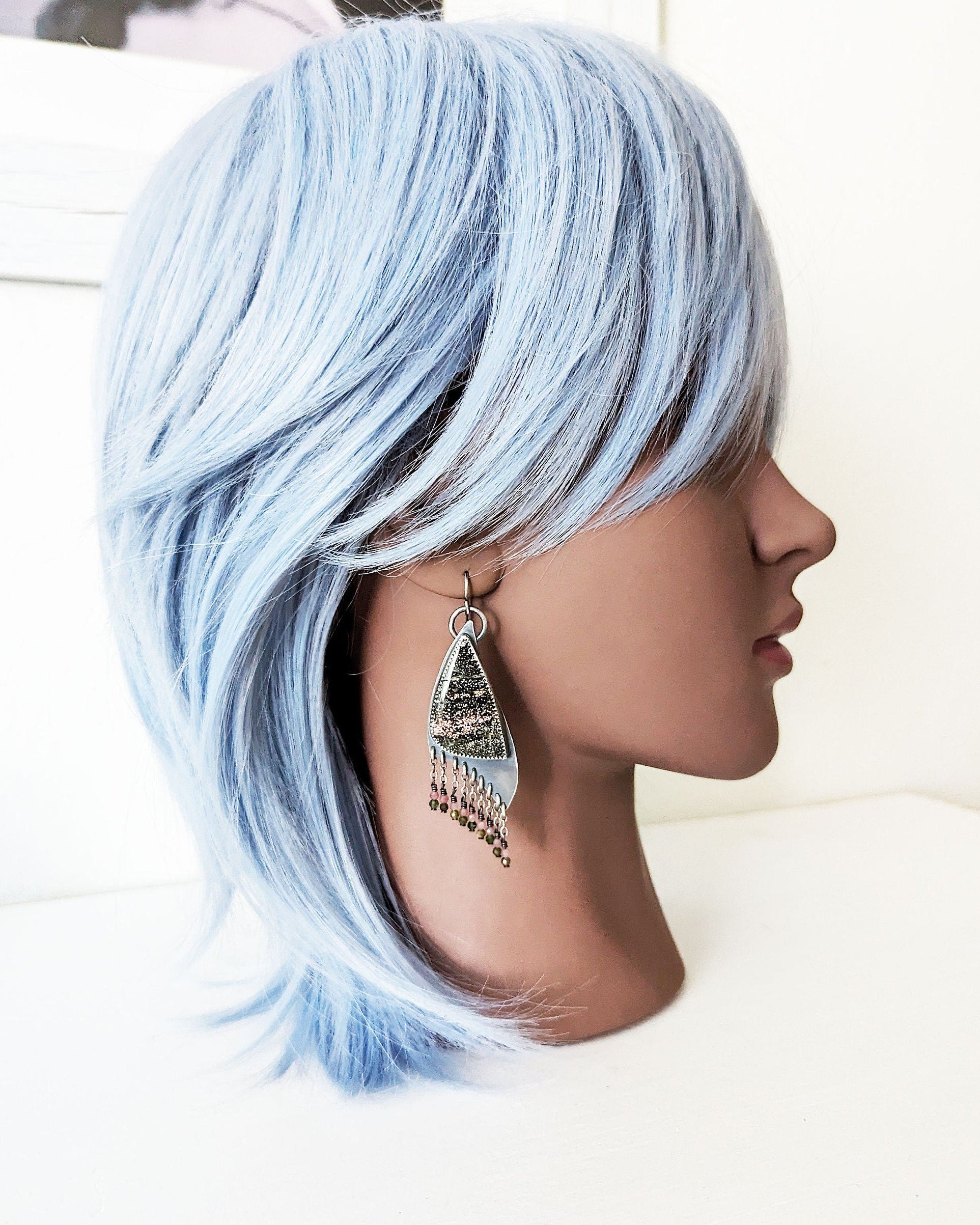 Collector gemstone earrings with shimmering druzy texture on mannequin for scale