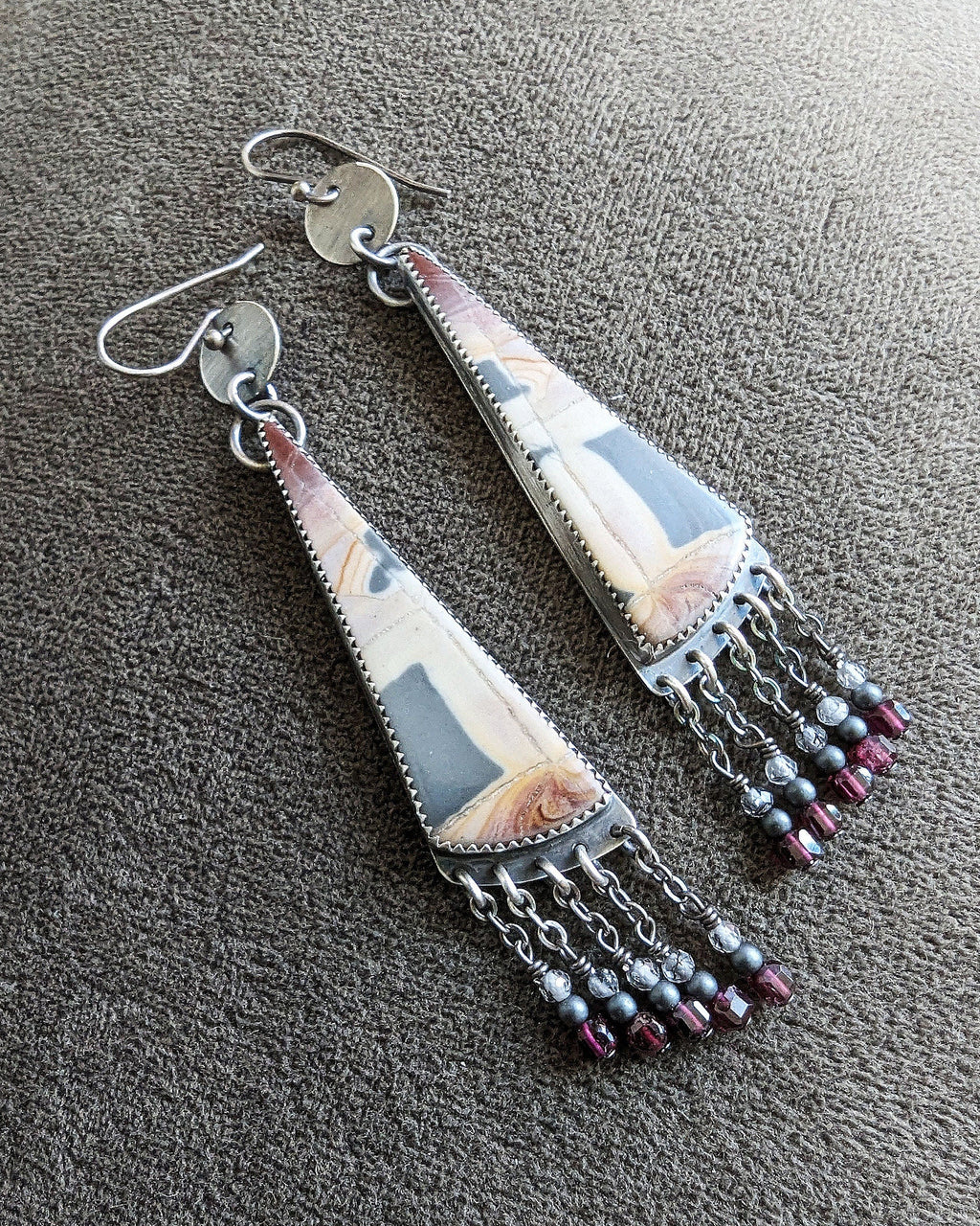 Collector sterling silver earrings with structured yet organic aesthetic