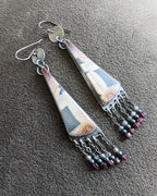 Collector sterling silver earrings with structured yet organic aesthetic