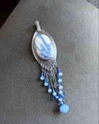 Artisan sterling silver pendant with layered blue gemstone fringe