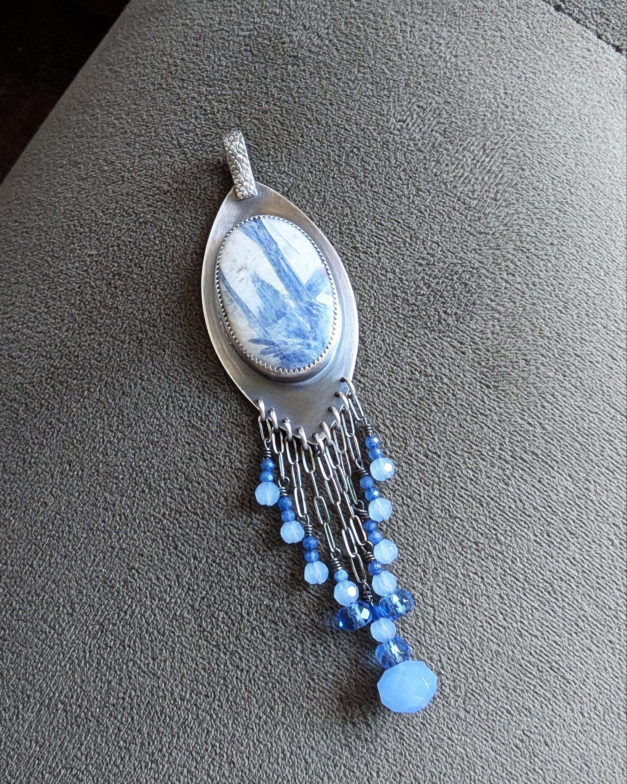 Artisan sterling silver pendant with layered blue gemstone fringe
