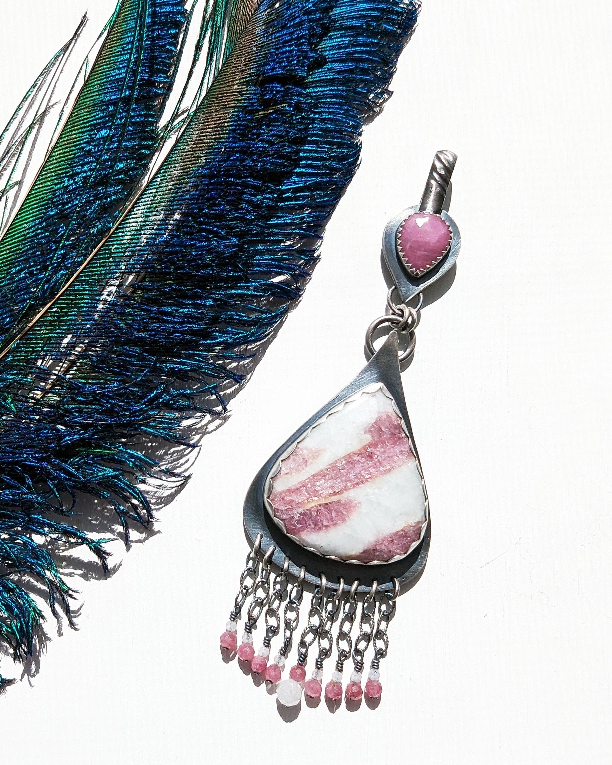 Handcrafted oxidized sterling silver pendant with pink gemstones and soft movement