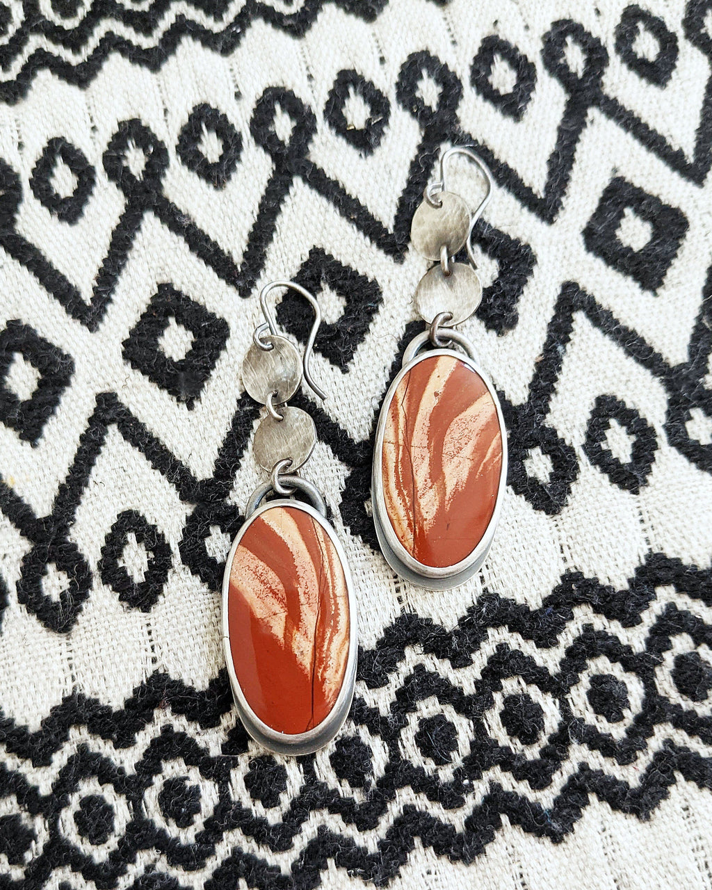 Handcrafted rainbow jasper earrings with fiery red and orange tones