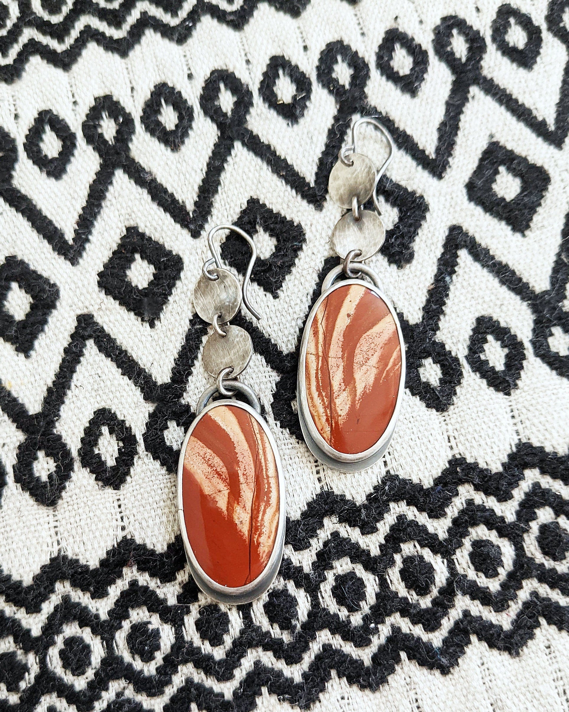 Handcrafted rainbow jasper earrings with fiery red and orange tones