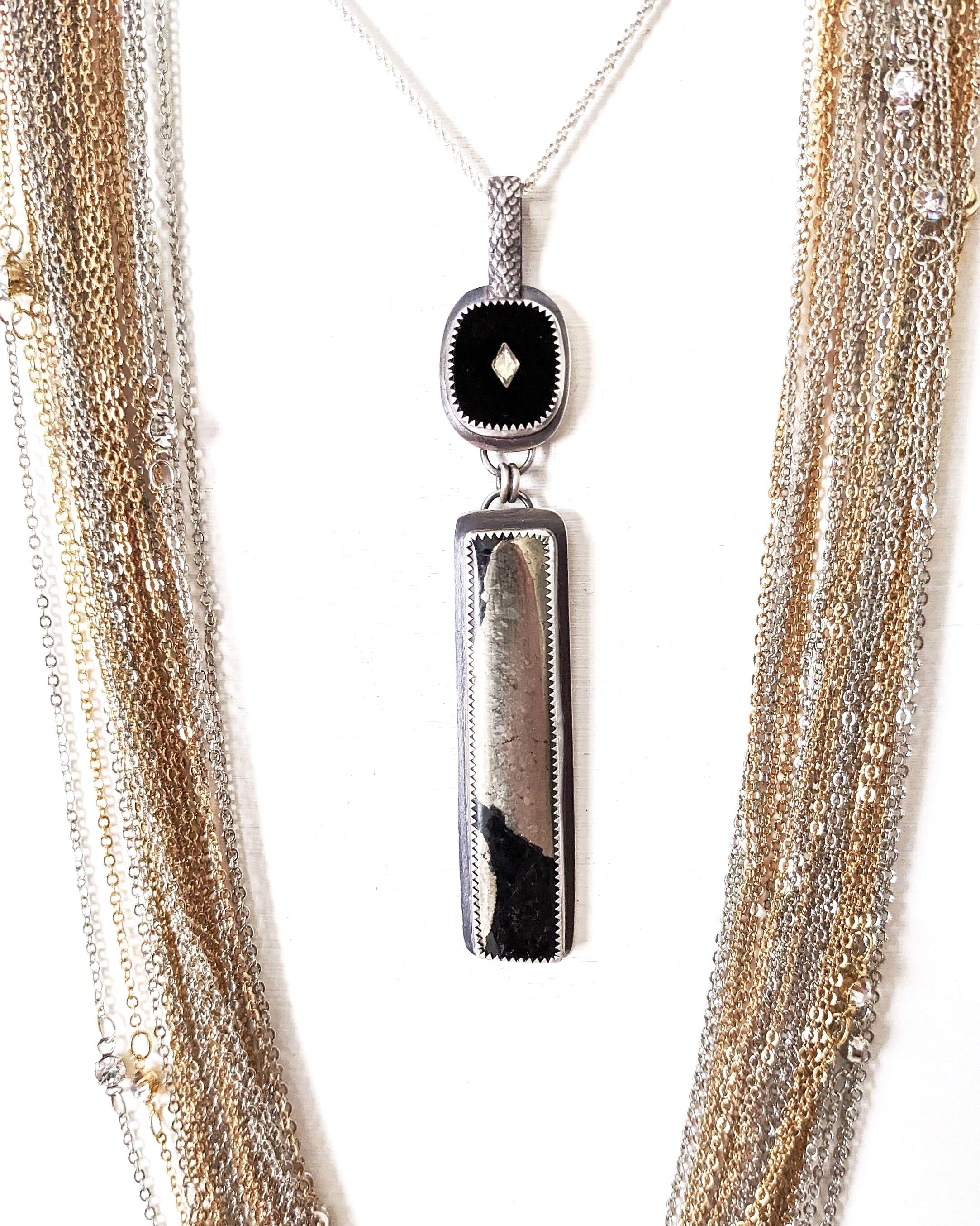 Apache pyrite pendant with vintage 1960s black glass cabochon shown on chain with layer necklace (not included)