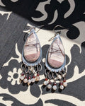 Rhyolite jasper earrings with garnet and moonstone fringe in oxidized sterling silver